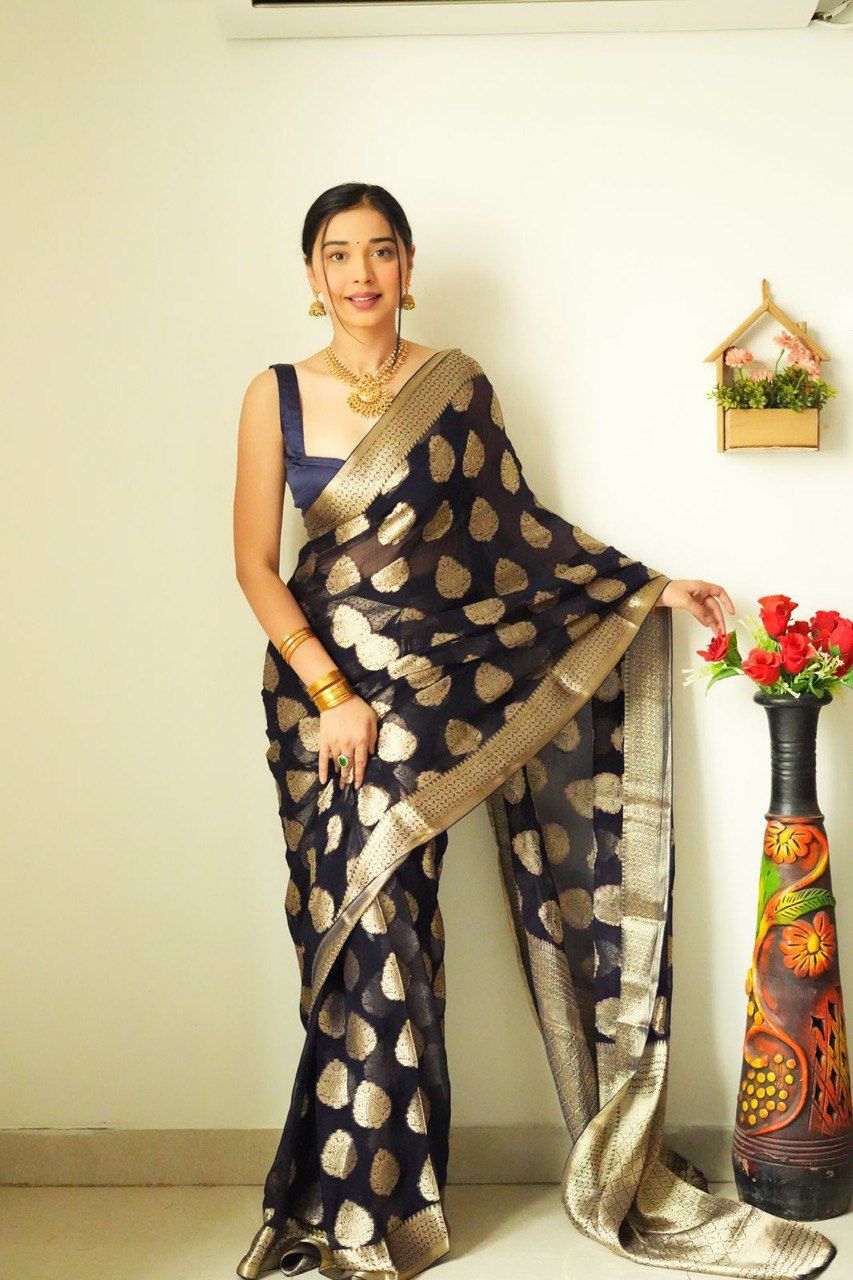 Close-up of the TRENDBUY ready-to-wear saree on a model, focusing on the intricate golden zari polka dot pattern and the luxurious texture of the Lilan cotton.