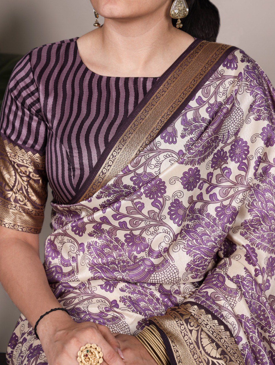 Close-up of TRENDBUY model in a lavender purple printed Tasar silk saree, highlighting the intricate pattern and striped blouse.