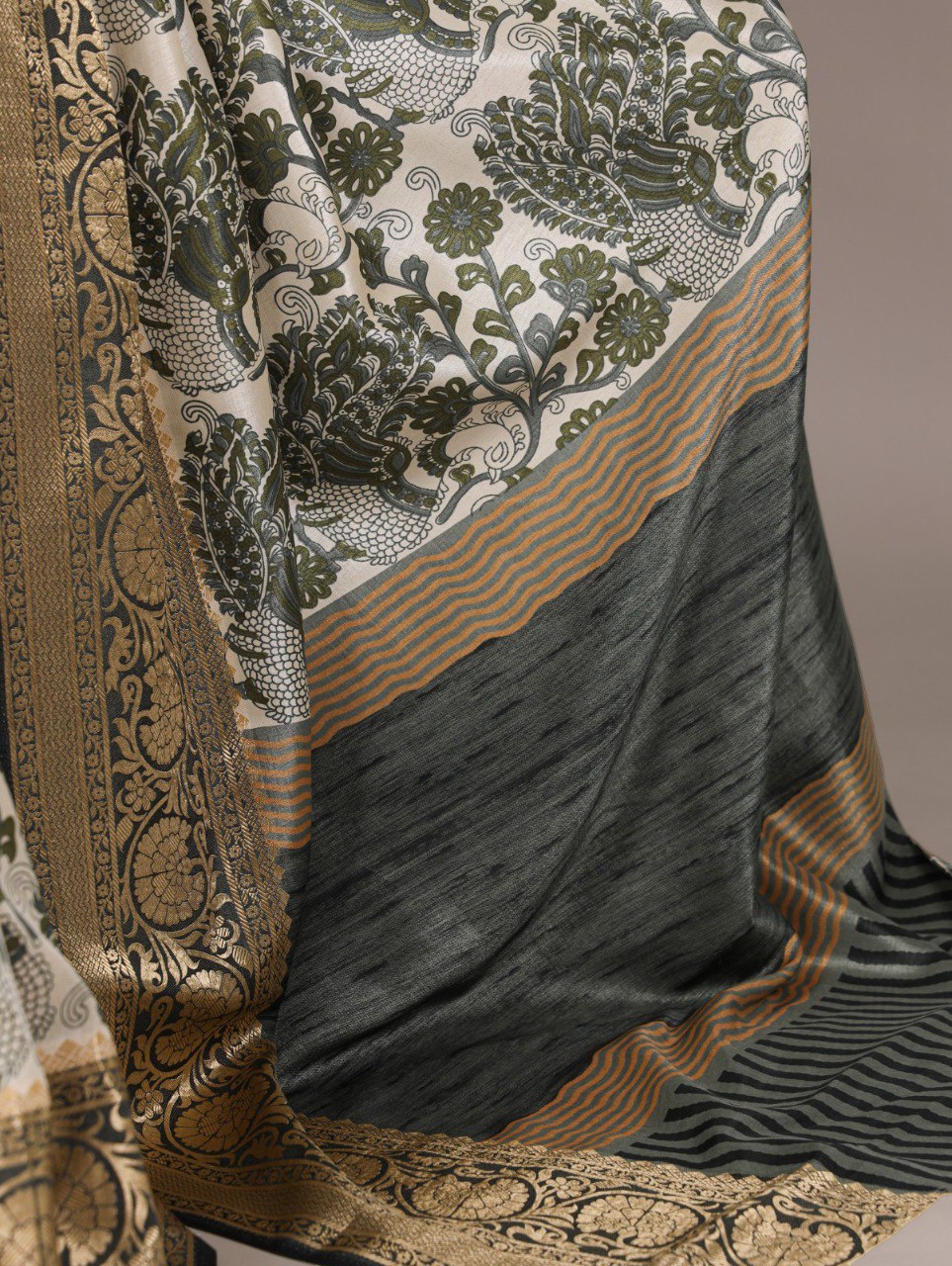 Detailed view of the rich patterns and striped pallu of a mint green TRENDBUY printed Tasar silk saree with viscose border.