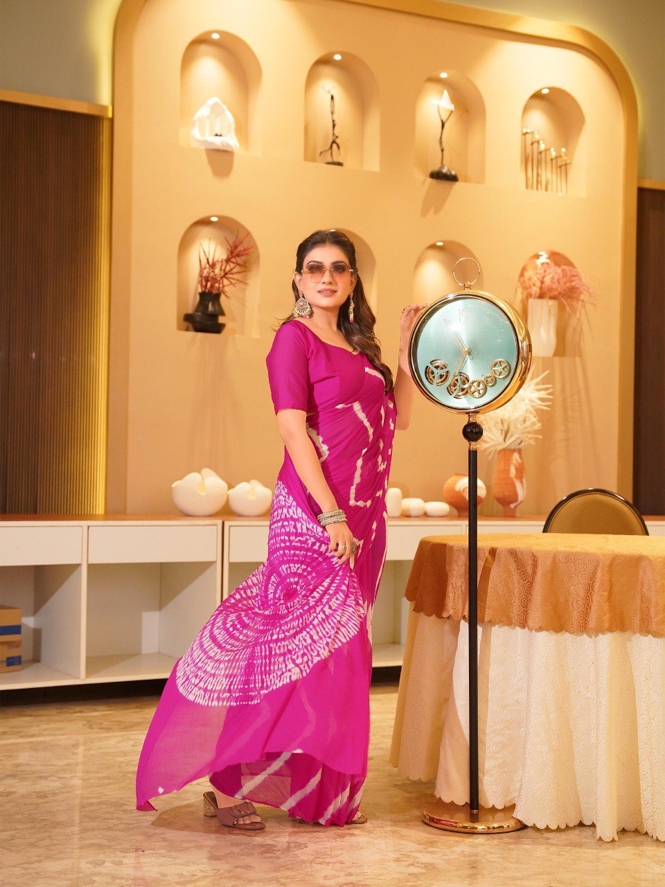 Full-length view of TRENDBUY model in a flowing fuchsia pink Pure Chinoon Hand Shibori Laheriya saree.
