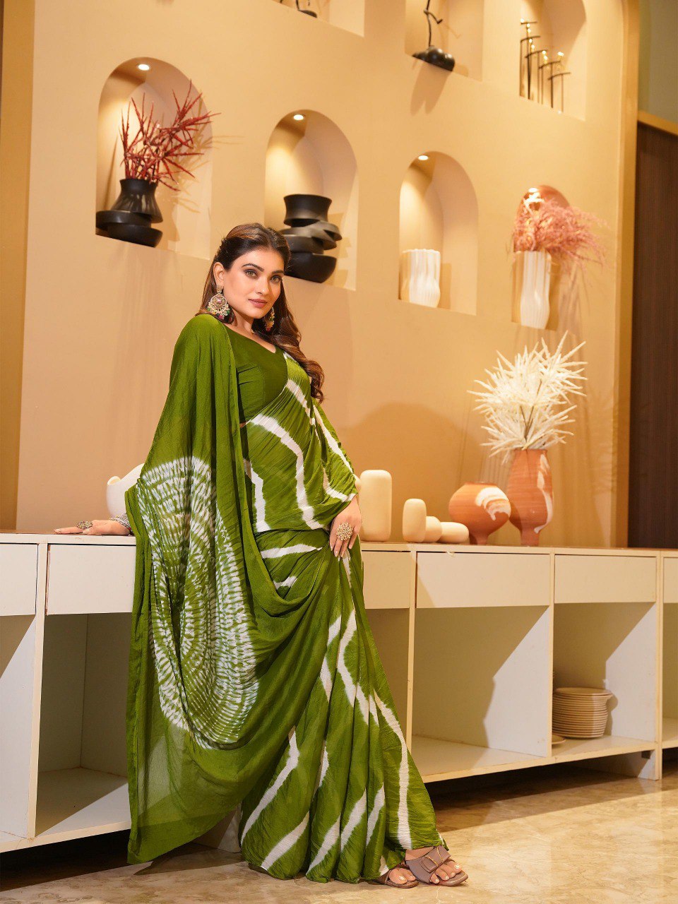 TRENDBUY model elegantly draped in an olive green Pure Chinoon Hand Shibori Laheriya saree.