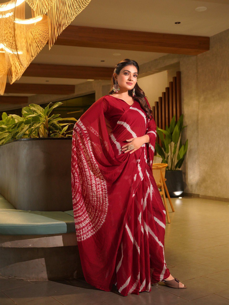 TRENDBUY model standing tall in a rich maroon Pure Chinoon Hand Shibori Laheriya saree.