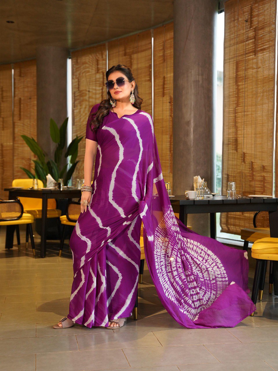TRENDBUY model posing in a beautiful lavender Pure Chinoon Hand Shibori Laheriya saree with sunglasses.