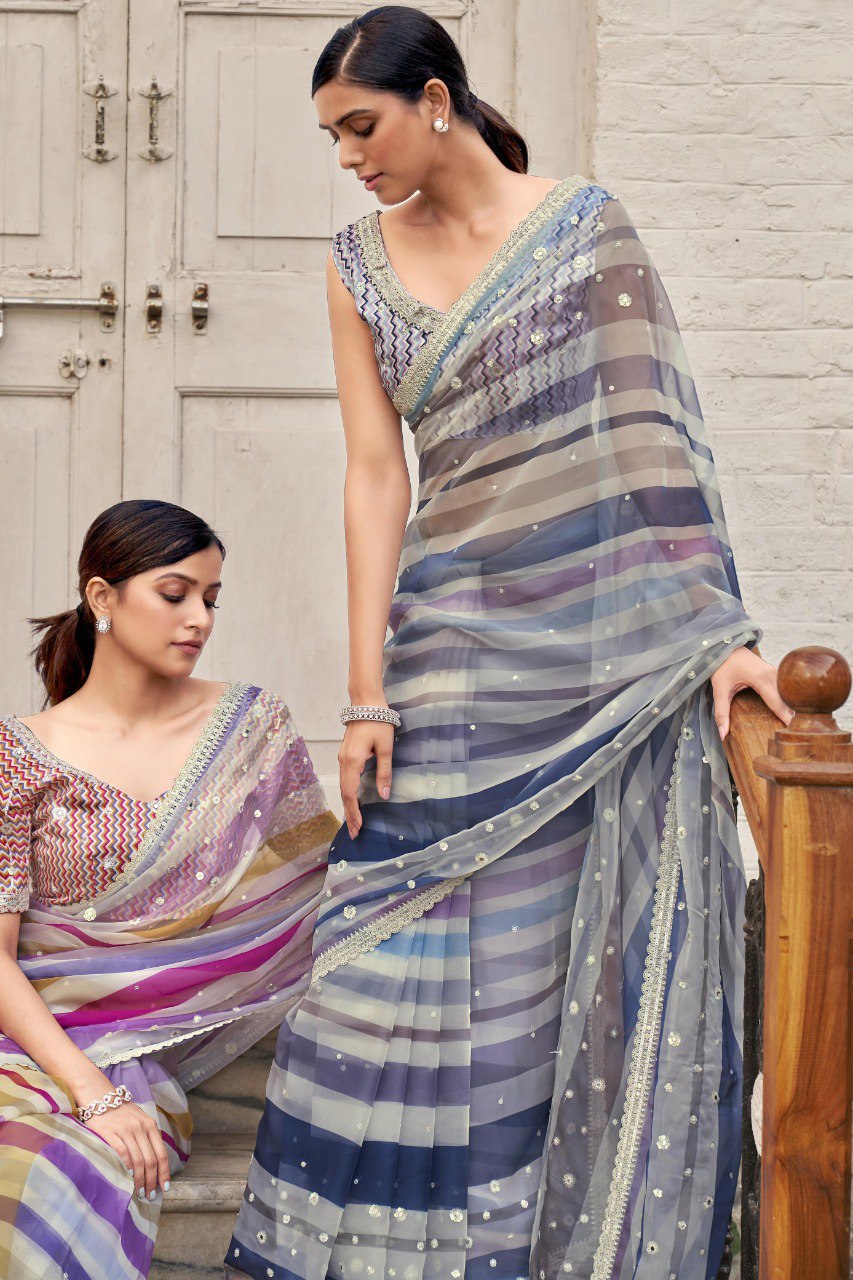 Two models showcasing the different color variants of the striped georgette sarees with matching blouses.