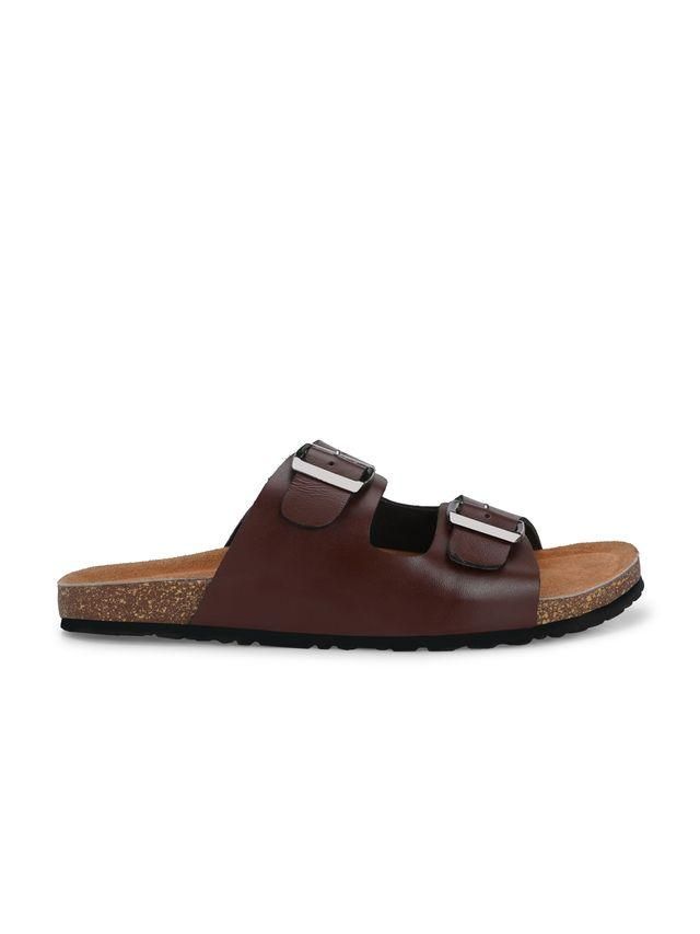 Brown sandal with two buckles on a white background