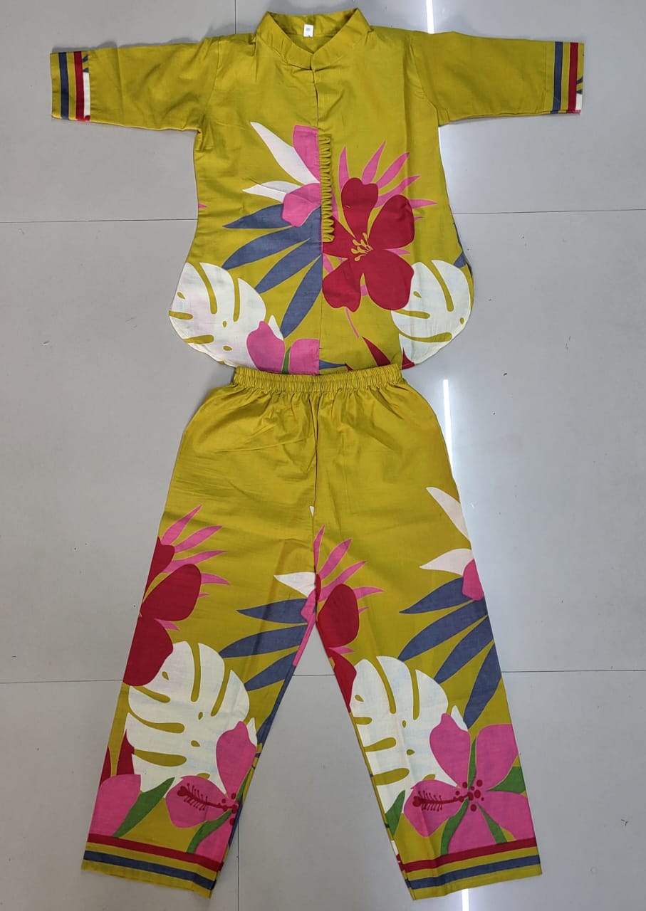 Overhead flat lay shot of a yellow floral printed kids kurta and pants co-ord set, showcasing fabric and print detail.