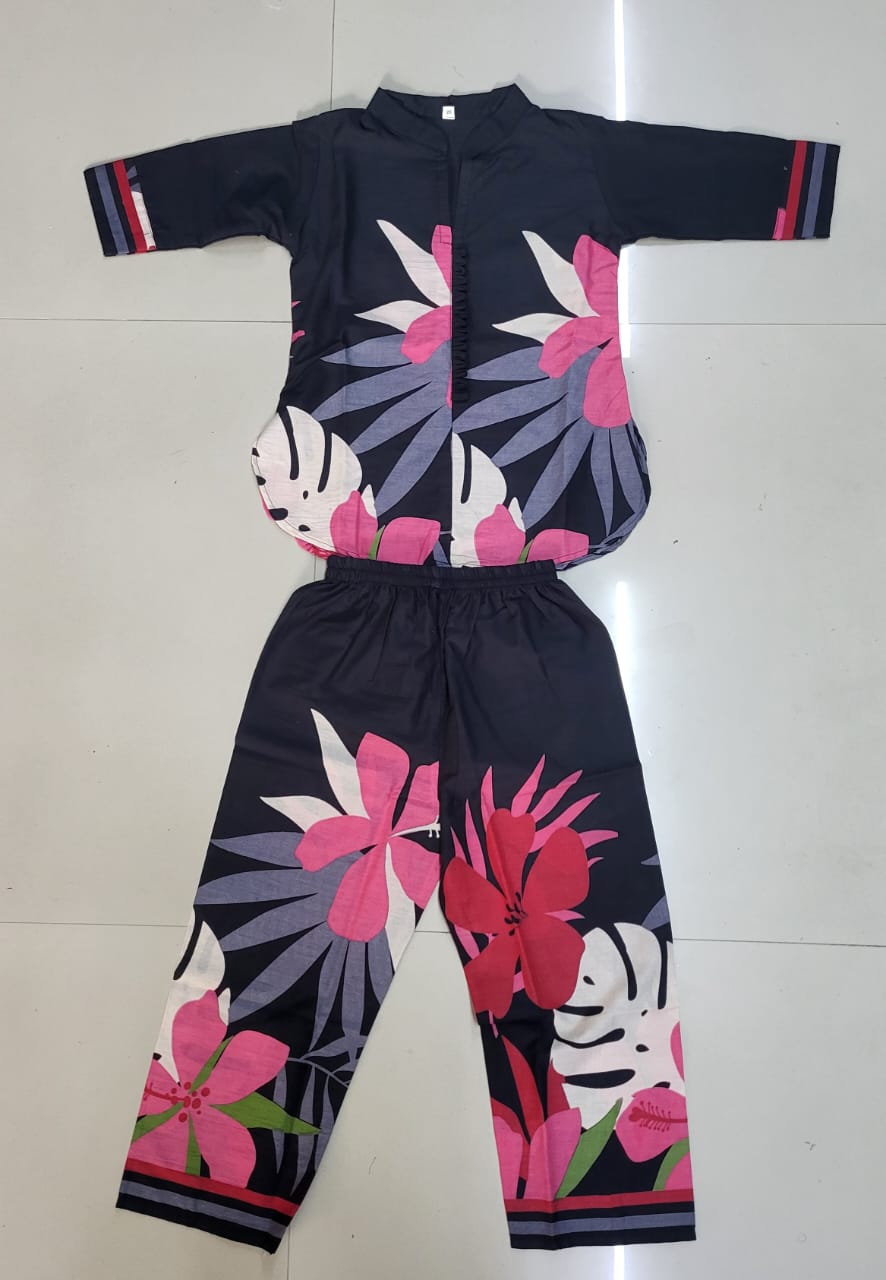 Overhead flat lay shot of a black floral printed kids kurta and pants co-ord set, highlighting the design and material.