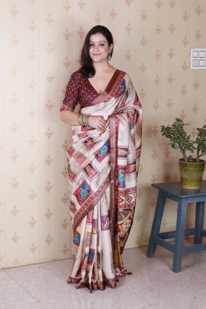 Full shot of model wearing a maroon polka dot blouse and beige Tussar silk saree with rich traditional digital prints.