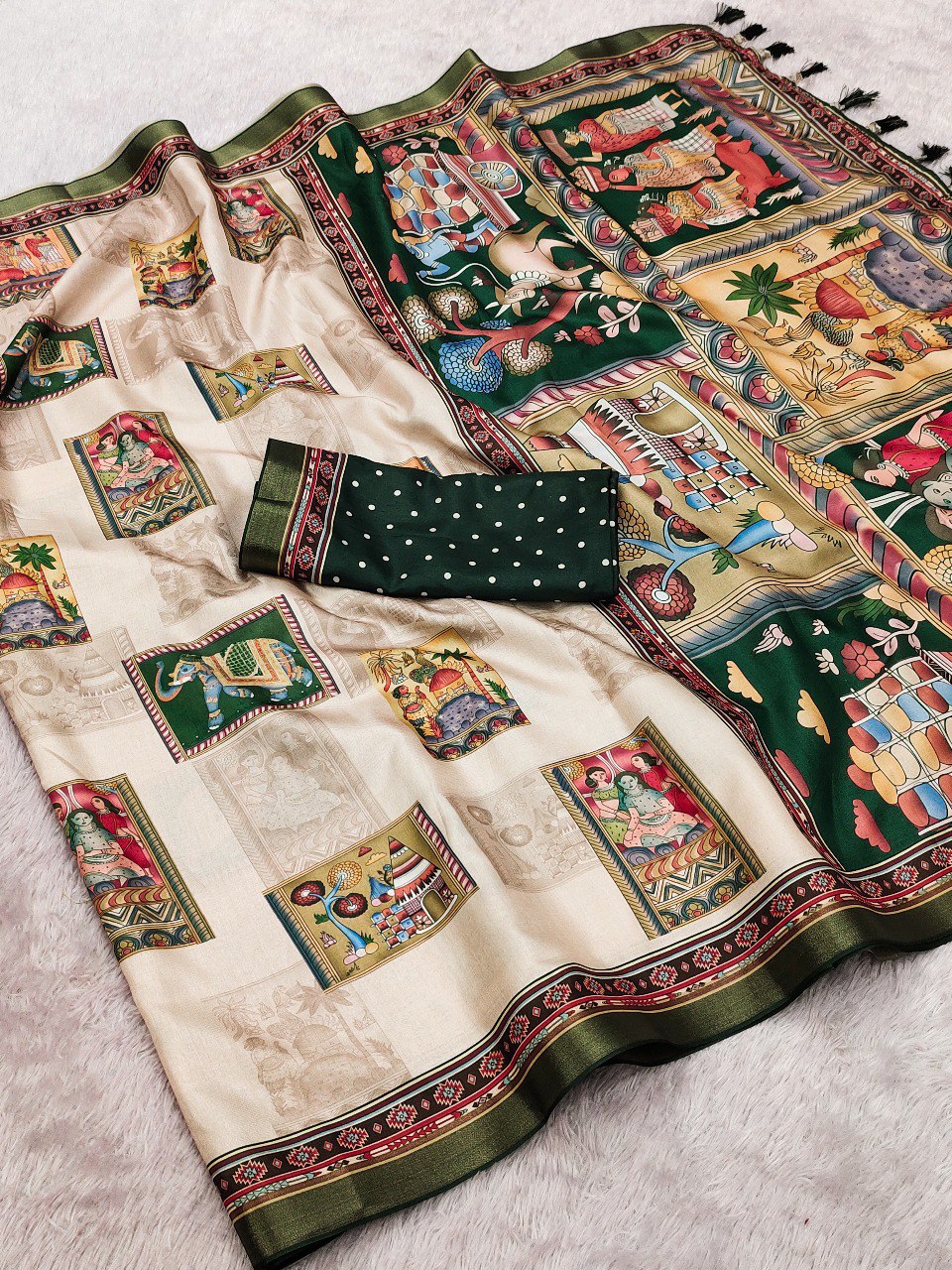 Flat lay of the Emerald Elegance Tussar silk saree with detailed folk art digital prints and matching polka dot blouse.