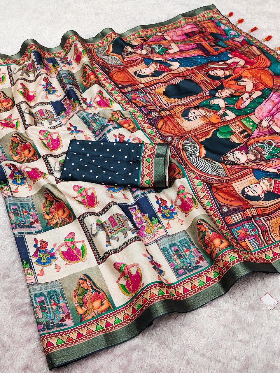 Flat lay of the Forest Green Flair Tussar silk saree with vibrant multi-color traditional panels and dark green polka dot blouse.