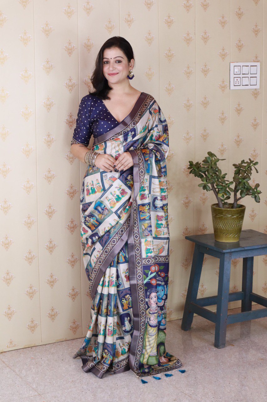 Full shot of model wearing the sapphire blue polka dot blouse and beige Tussar silk saree with traditional digital prints.
