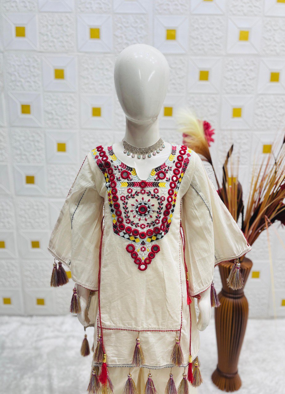 Mannequin displaying white khadi cotton top with red and yellow embroidery, real mirror work neckline.