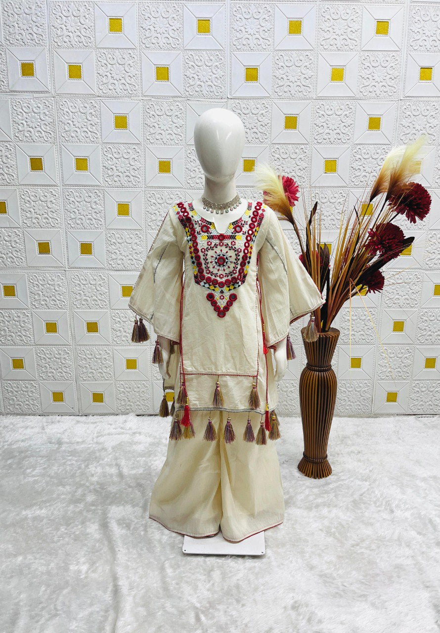 Full view of the khadi cotton plazzo set on a mannequin, emphasizing the flared plazzo and the richly decorated top.
