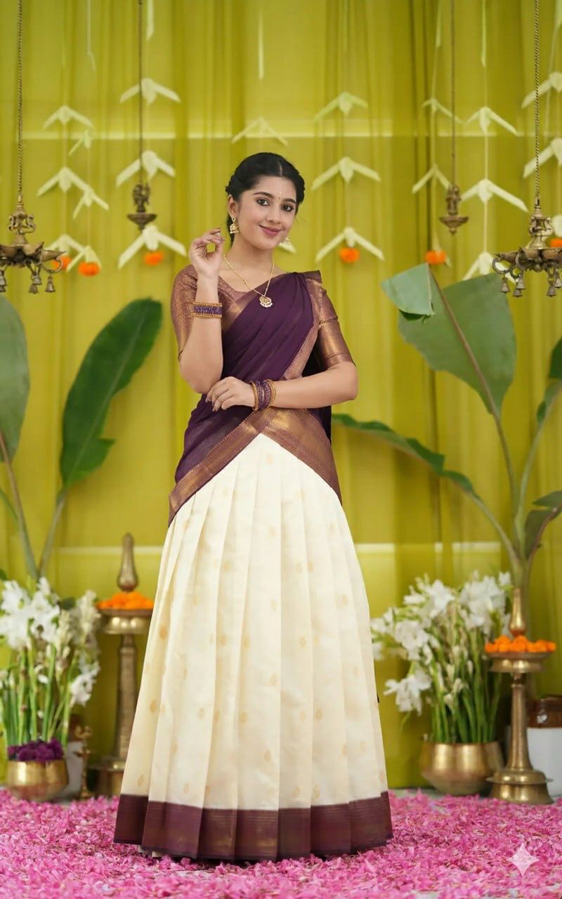 TRENDBUY Kanjiveram Silk half saree lehenga set in rich wine color with gold zari, showcased by a model against a festive backdrop.