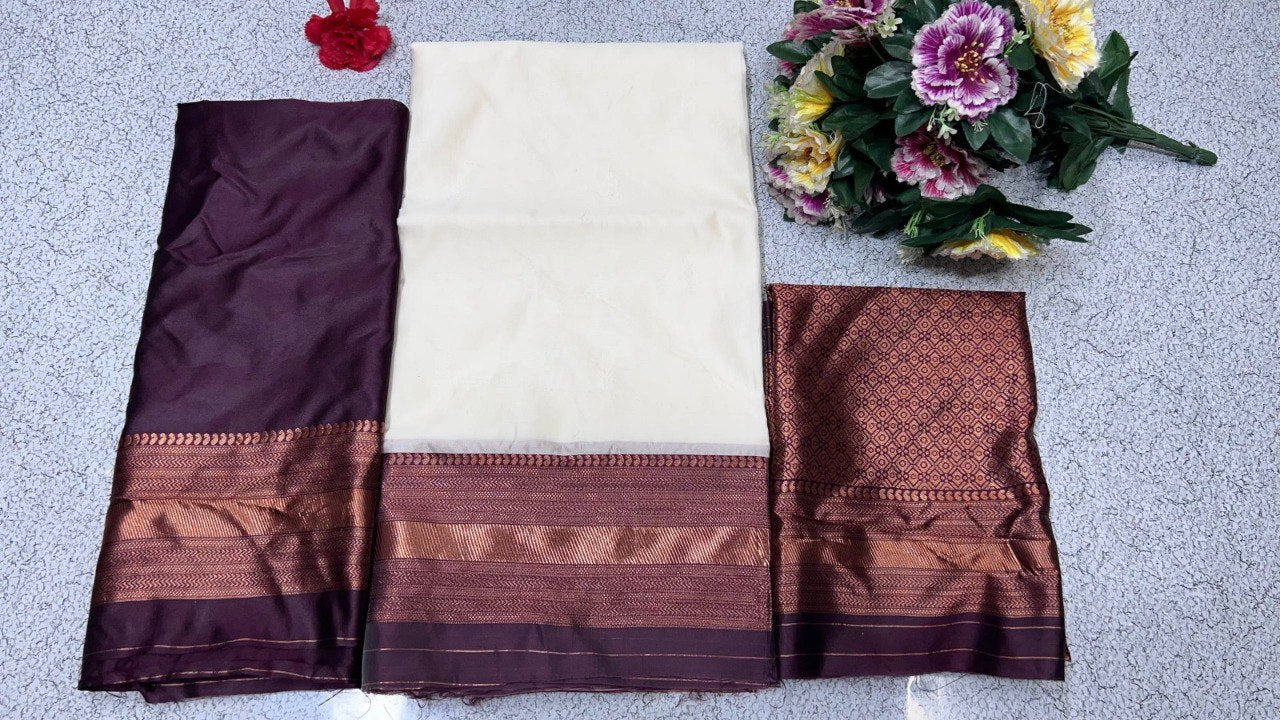 Flat lay of TRENDBUY Kanjiveram Silk half saree lehenga fabric set in wine: cream lehenga, wine blouse piece, and banarasi voni.
