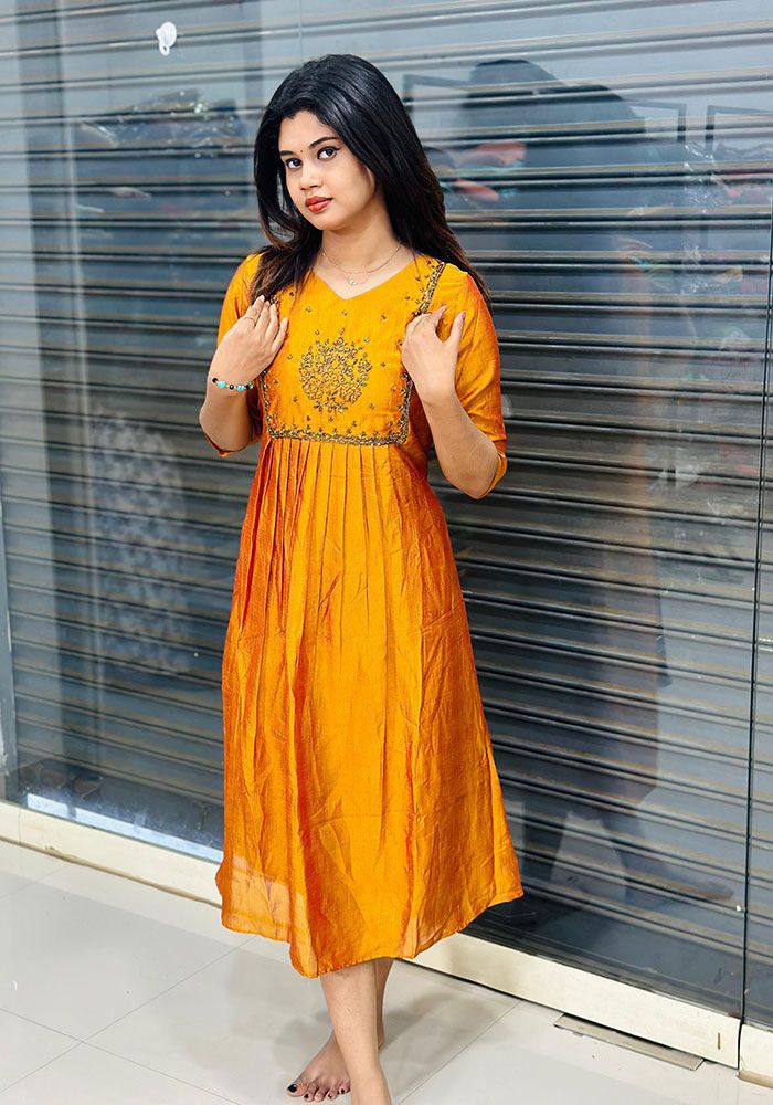 Model in the bright yellow handwork kurti, perfect for a Haldi ceremony or festive puja