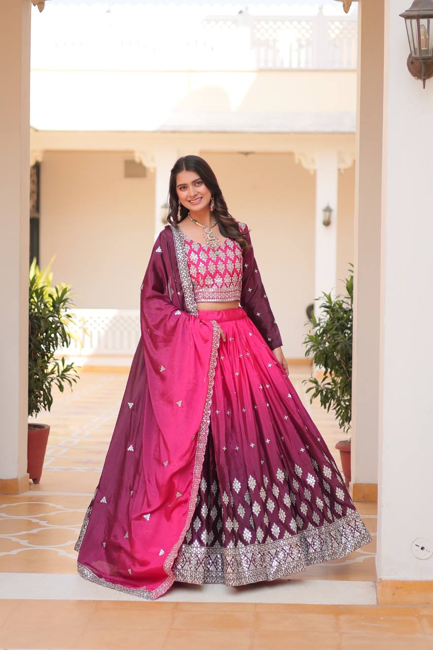 Chinon wedding lehenga choli, heavily embroidered with gold and colorful traditional designs