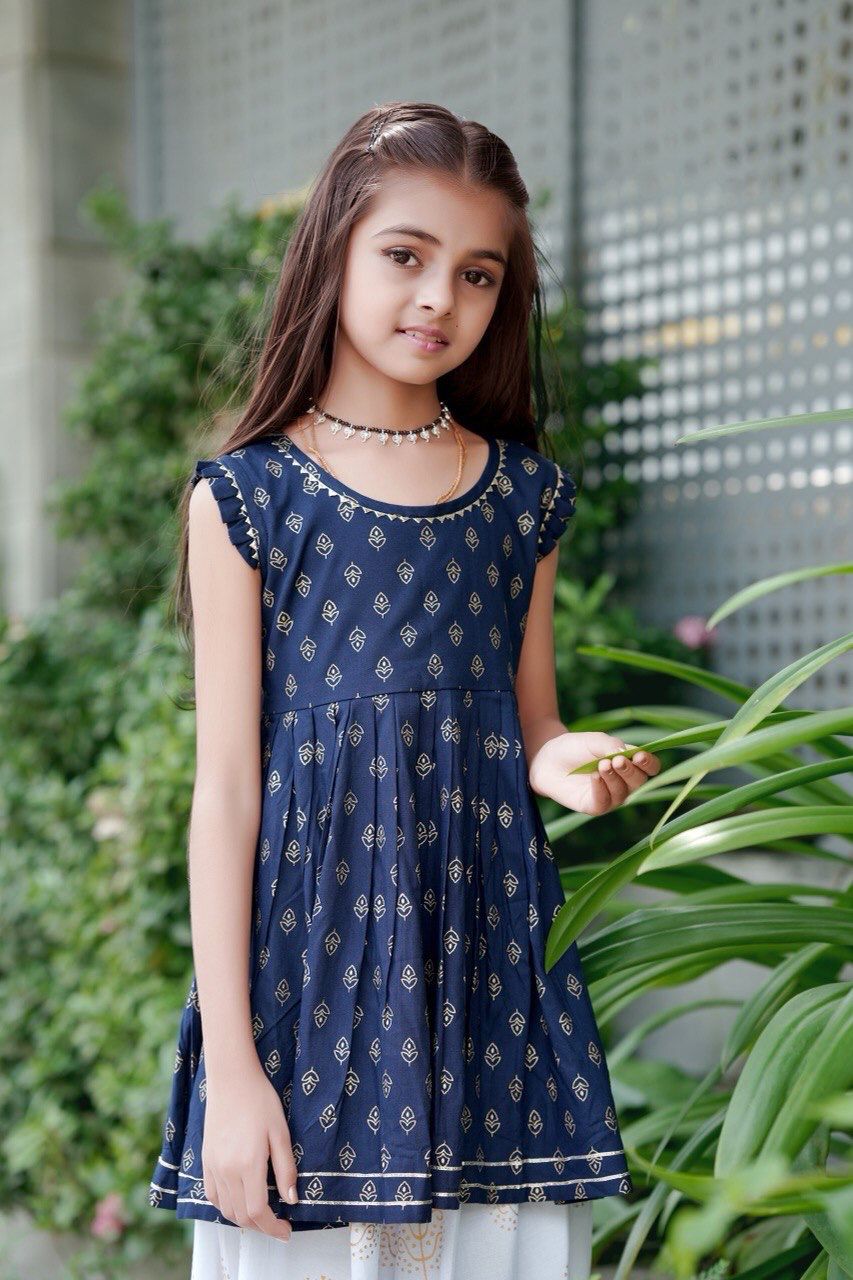 Girl twirling in the Navy Blue foil print kurti and dhoti patiala set