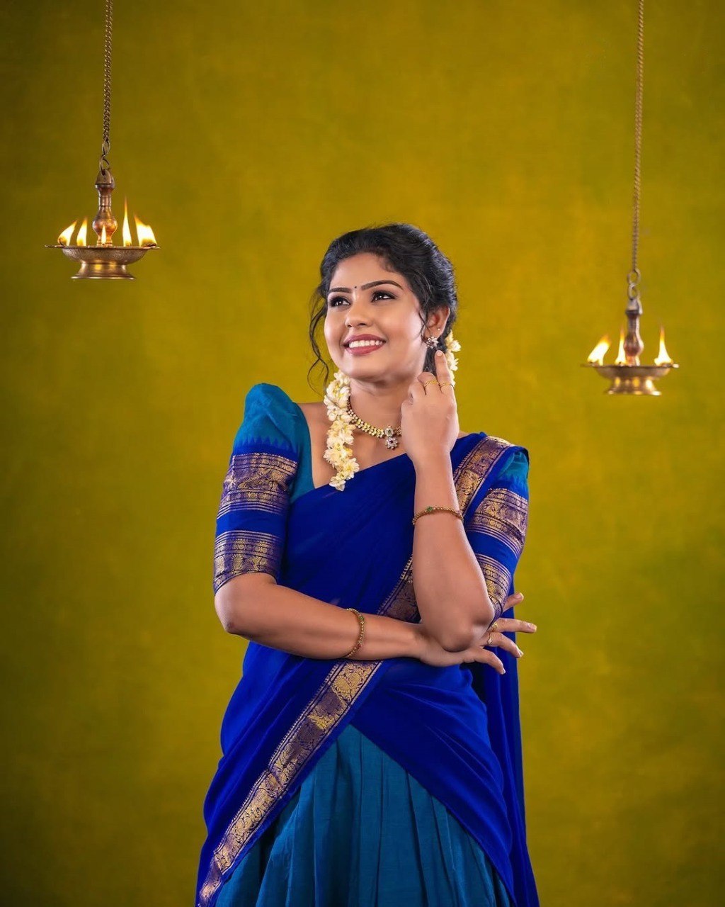 Full view of the blue Kanjivaram silk half saree style lehenga with Zari border
