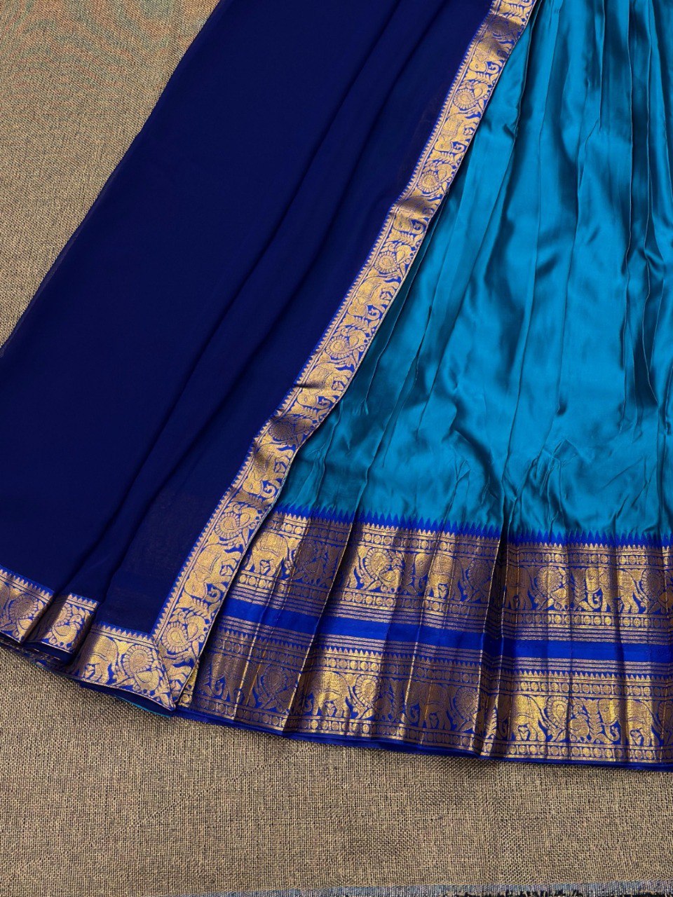 Flat lay of the 3-piece Kanjivaram silk lehenga set, showing the stitched lehenga, unstitched blouse, and georgette dupatta