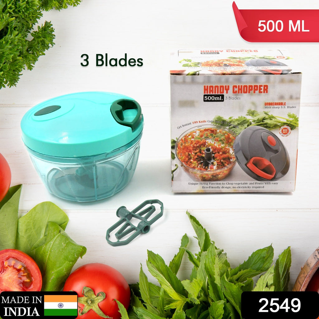Person using a compact hand-held manual food chopper to quickly dice vegetables like onions.