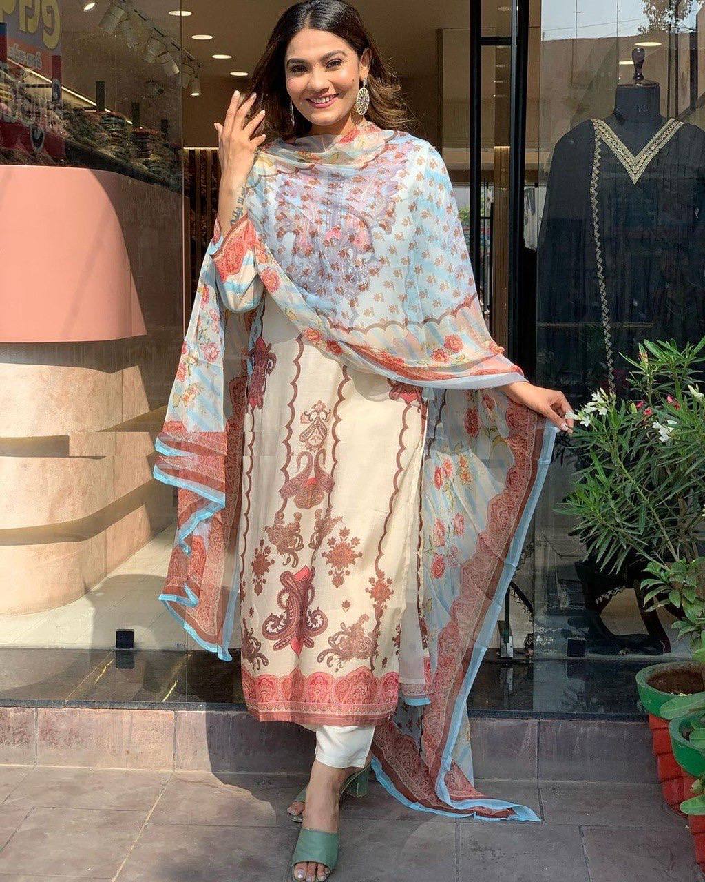 Close-up of the intricate geometric and floral digital print on the white kurti
