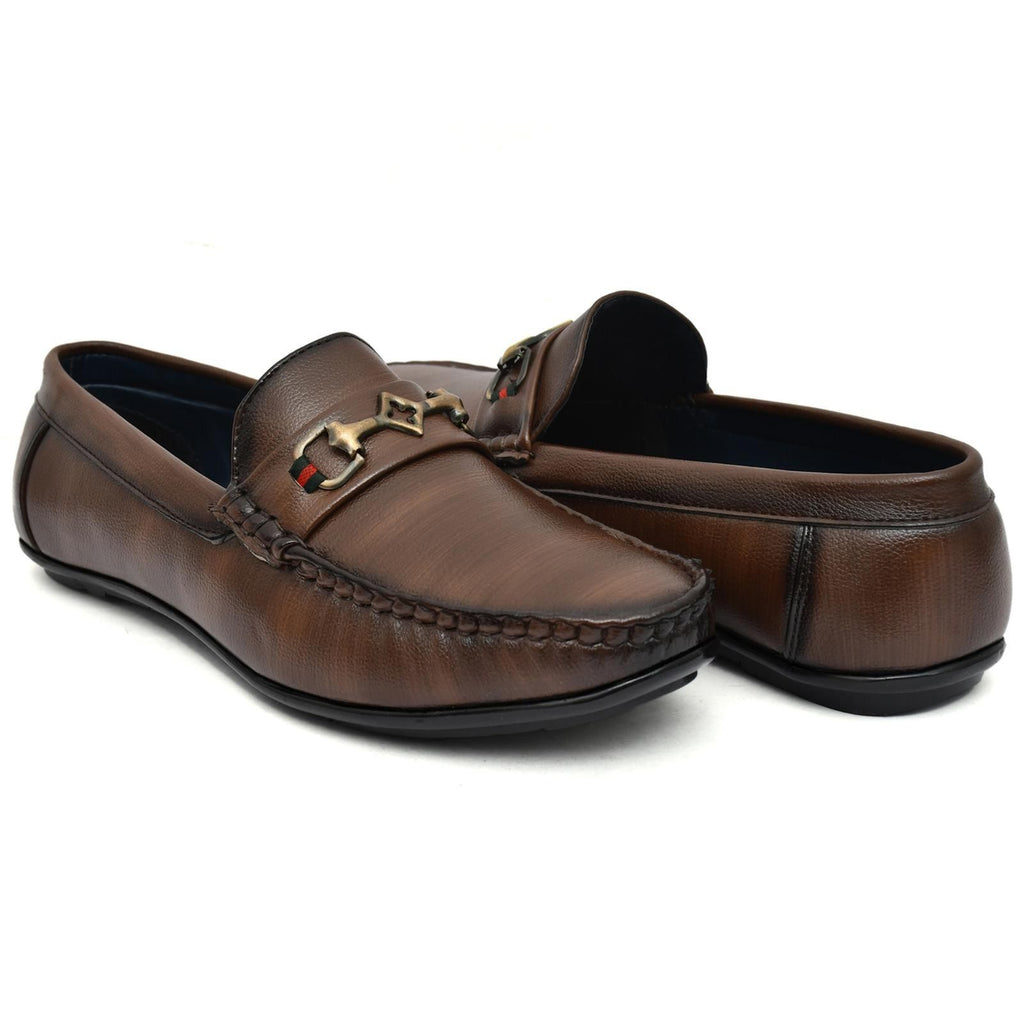 Pair of brown leather loafers with a decorative buckle on a white background