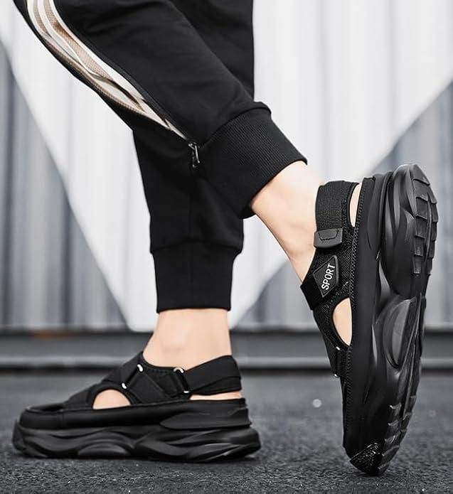 Person wearing black sandals with thick soles on a neutral background