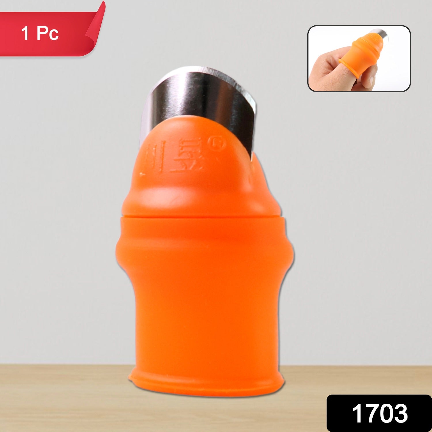 Green silicone thumb knife cutter with finger guard worn on a thumb.