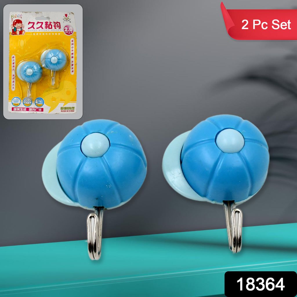 Multipurpose clear self-adhesive hooks (2 pc set) on a wall, one holding a small towel.