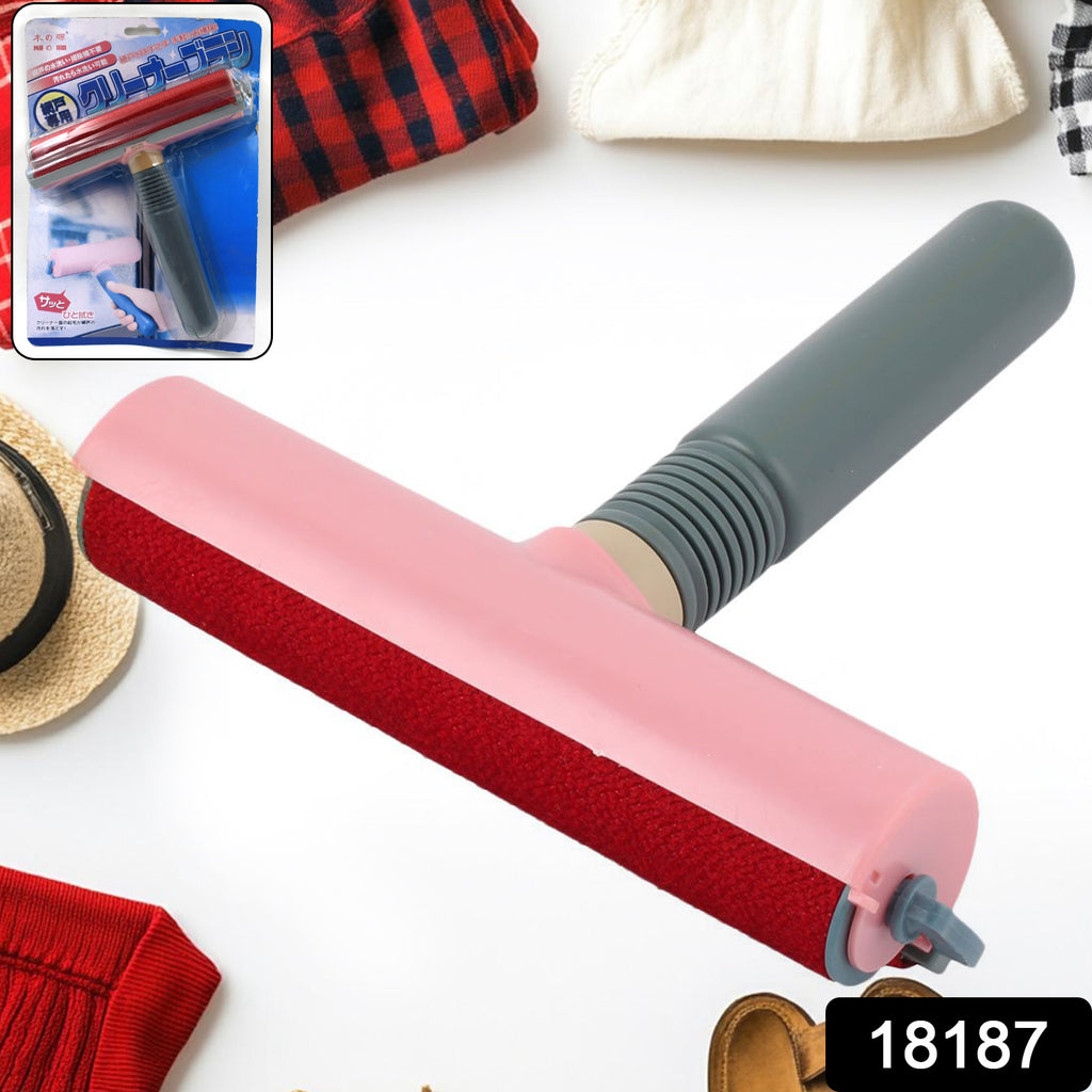 Plastic handle lint hair dust remover cleaning brush on a sofa.