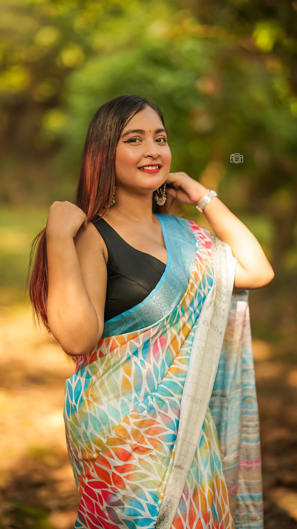 Beautifully draped light blue silk saree, showcasing its luxurious fabric and elegant design