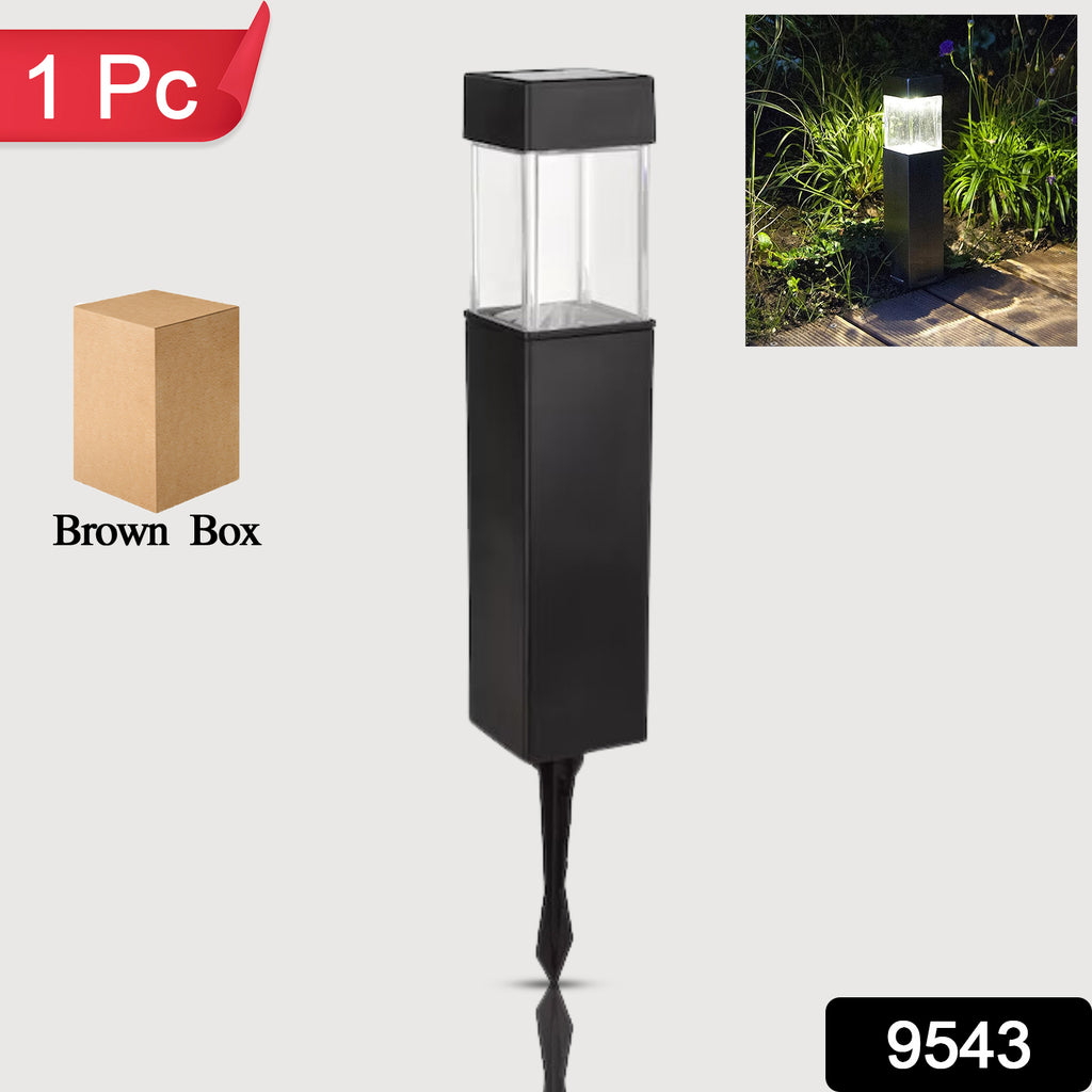 Big outdoor garden solar light post illuminating a park driveway at night.
