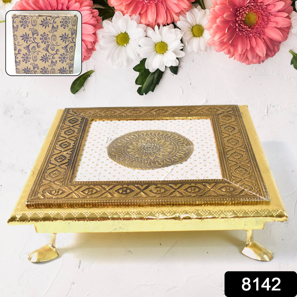 Golden square pooja chowki patla bajot, ornate metal stand for spiritual rituals.