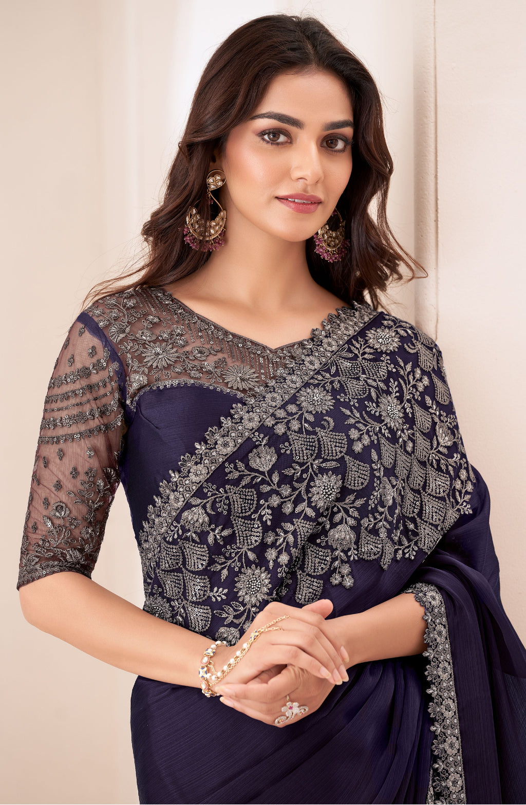 Close-up of the delicate gold embroidery patterns on the premium dark blue fabric