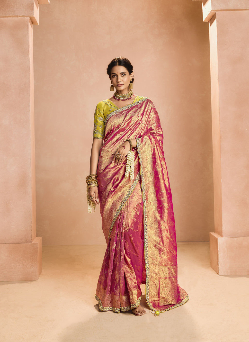 Beautiful wedding wear tissue silk saree, featuring an elegant drape and luxurious finish.