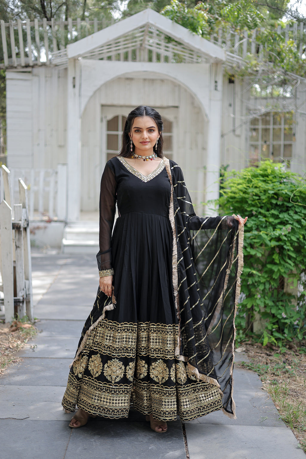 Elegant black Anarkali gown with a full-length design and a matching dupatta.