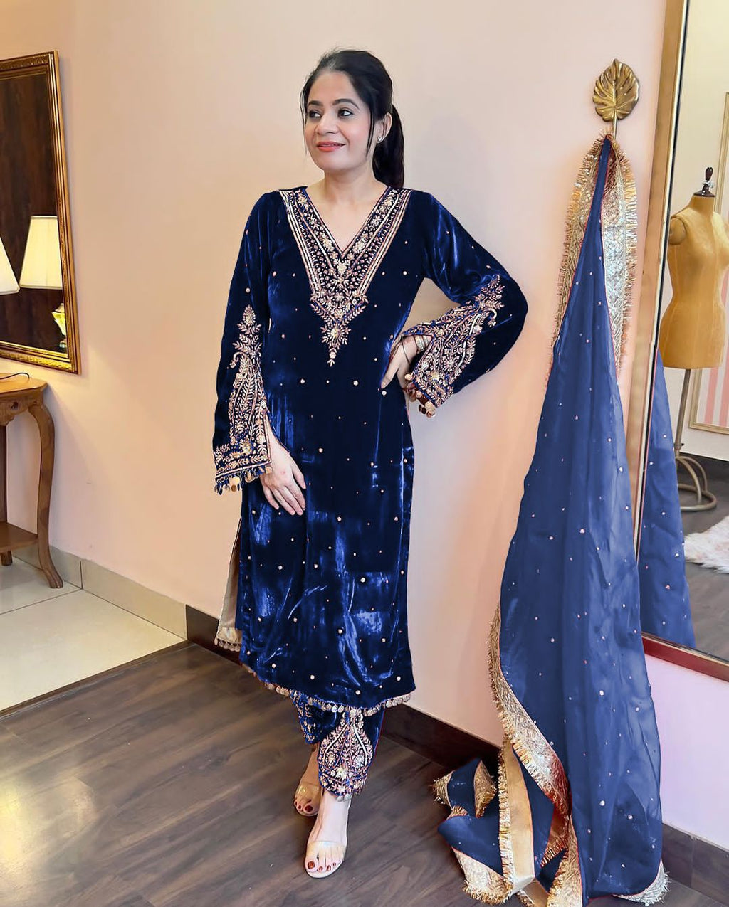 Blue Pakistani velvet suit with intricate gold embroidery