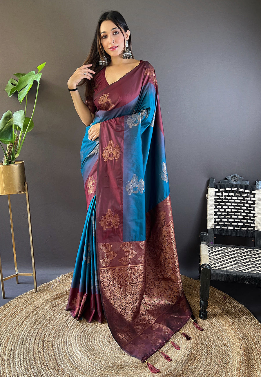 Blue soft silk saree featuring a floral border with contrast zari weave.