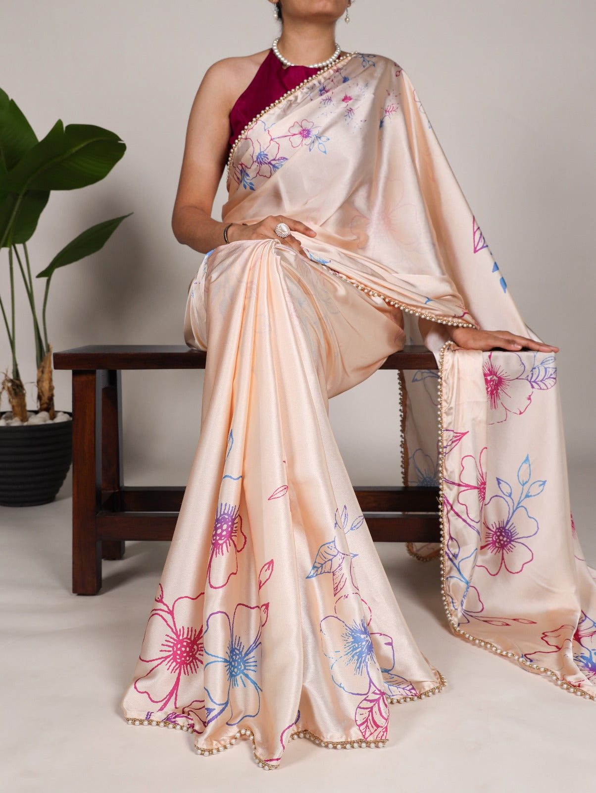 Cream Japan satin silk saree with digital floral print and elegant pearl lace border