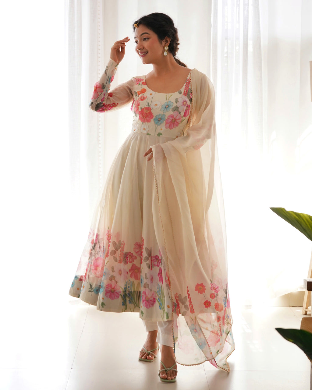 Cream Anarkali Organza Gown, elegant flowing design with delicate details.