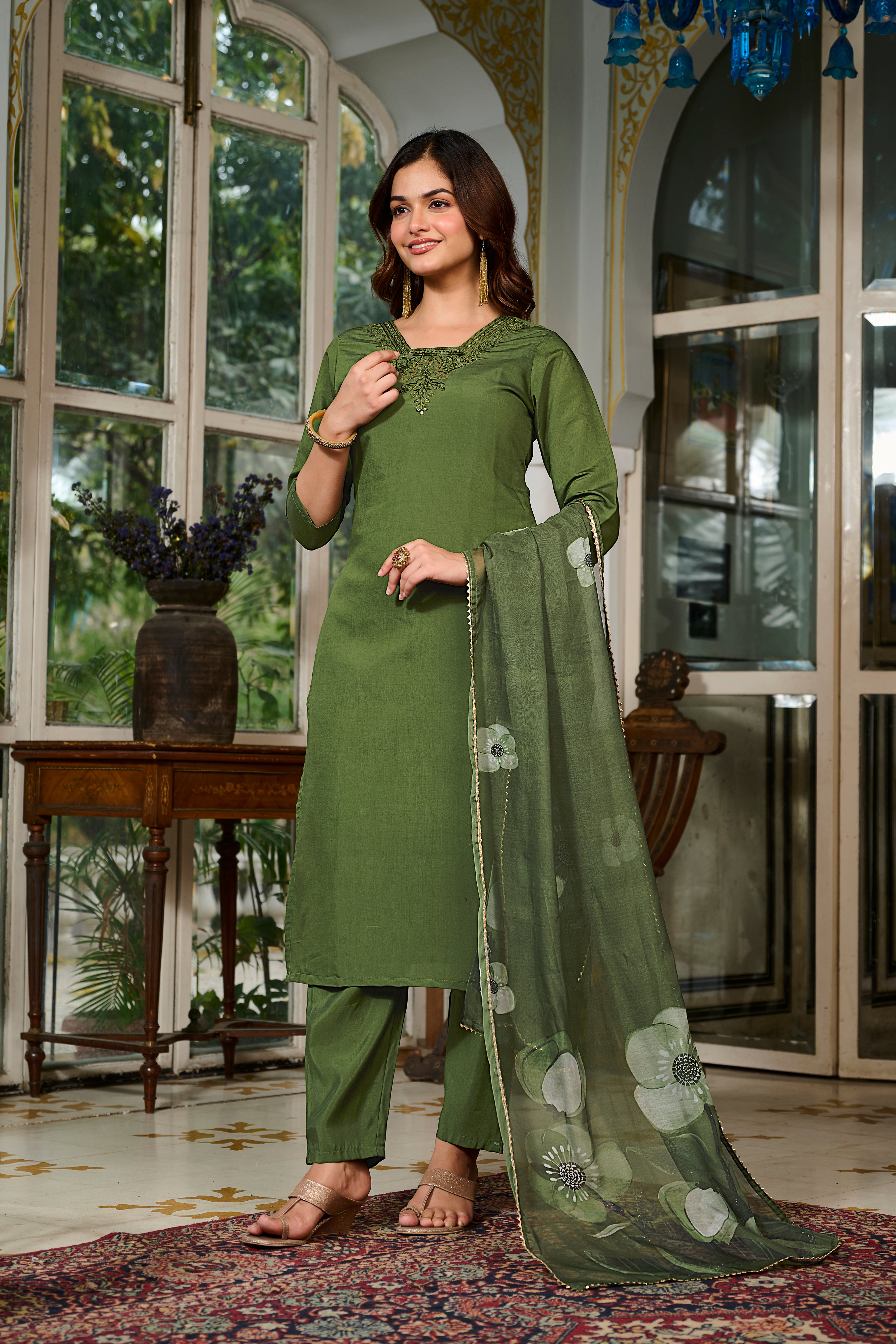 Smiling model in TRENDBUY green Viscose Chanderi kurta set, featuring intricate neckline embroidery and a floral printed Teby Organza dupatta