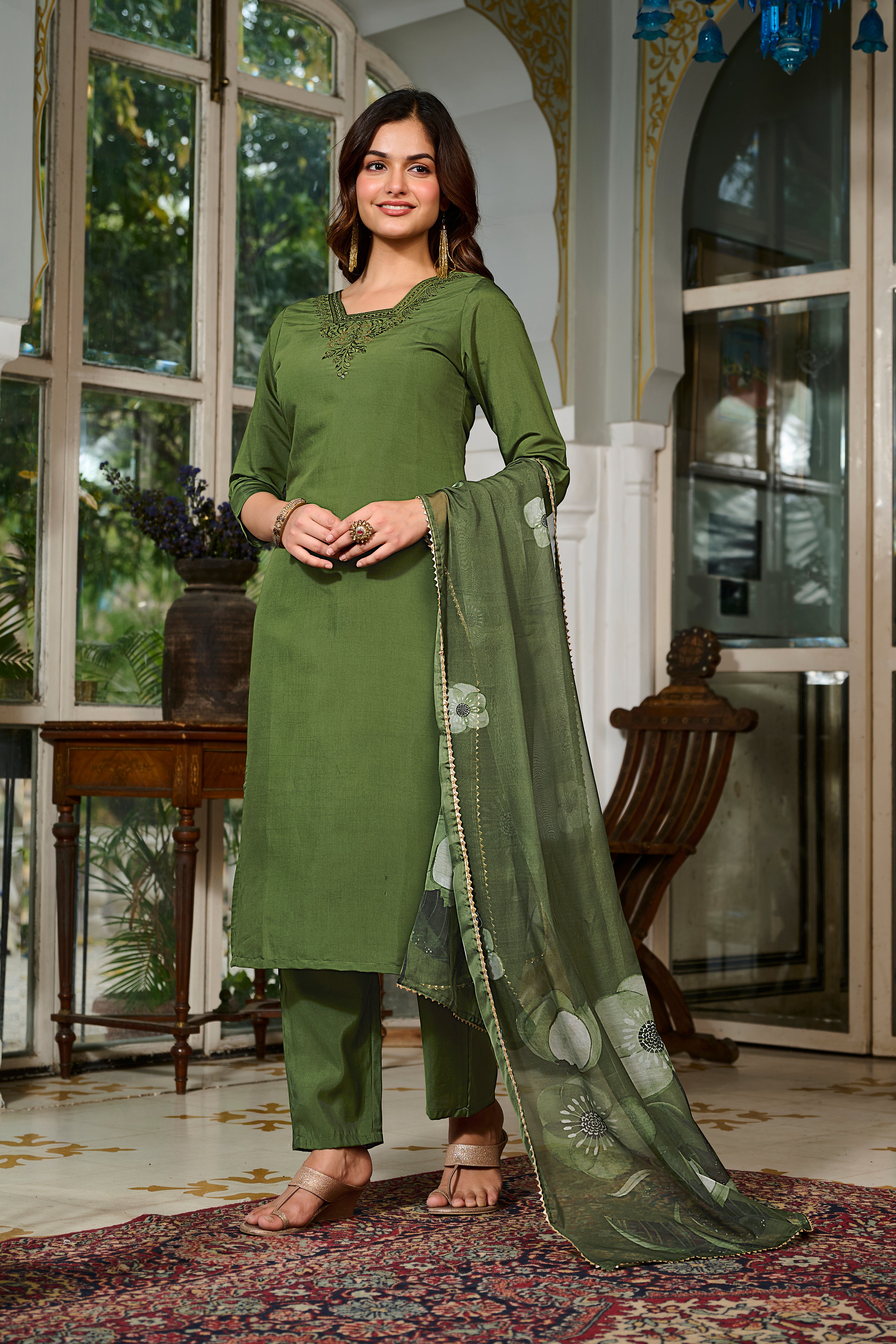 Model gracefully presenting the TRENDBUY green ethnic wear, with detailed embroidery on the kurta and a beautifully draped floral organza dupatta