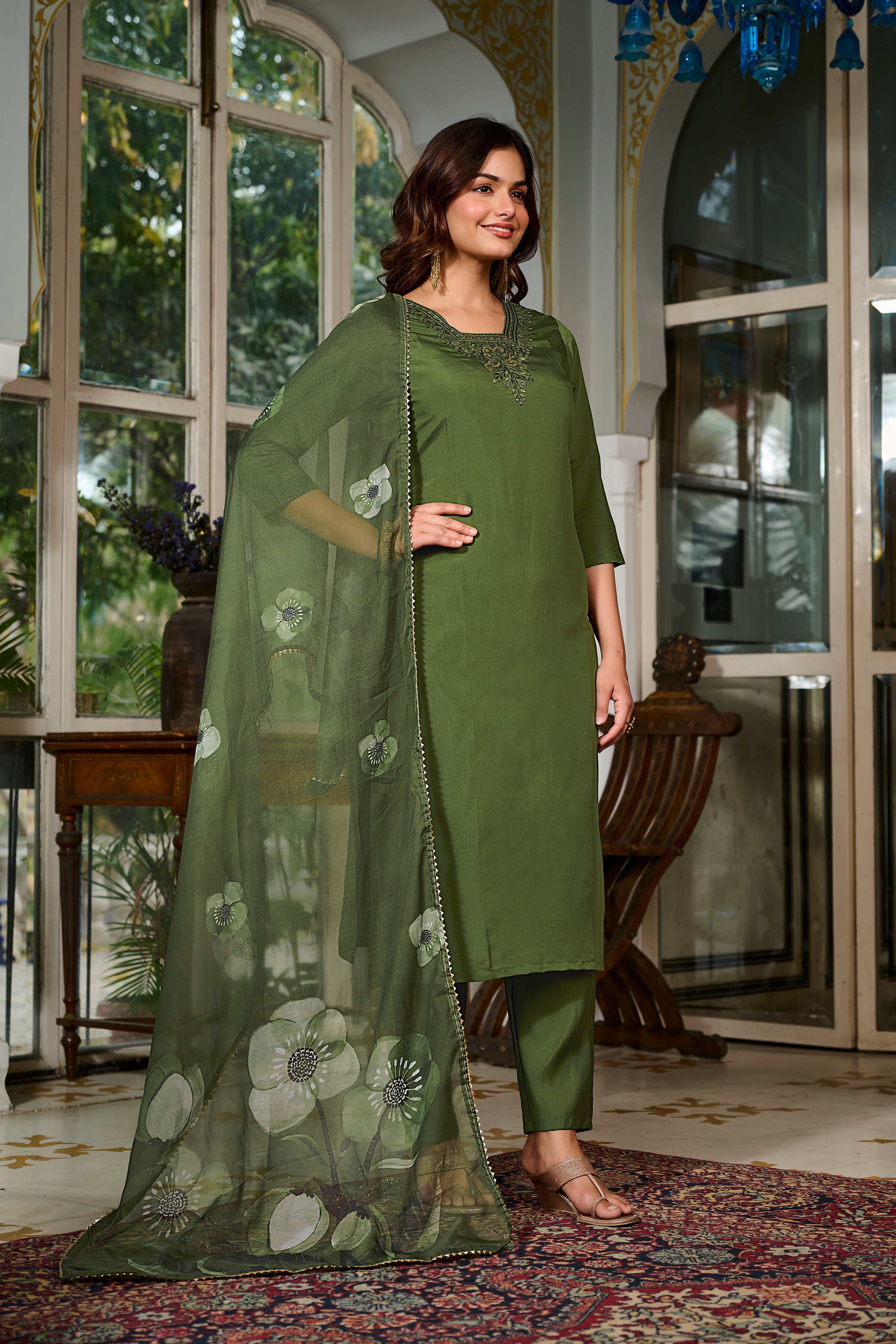 Side profile view of the model showcasing the flow and elegance of the TRENDBUY green Viscose Chanderi kurta and the printed Teby Organza dupatta