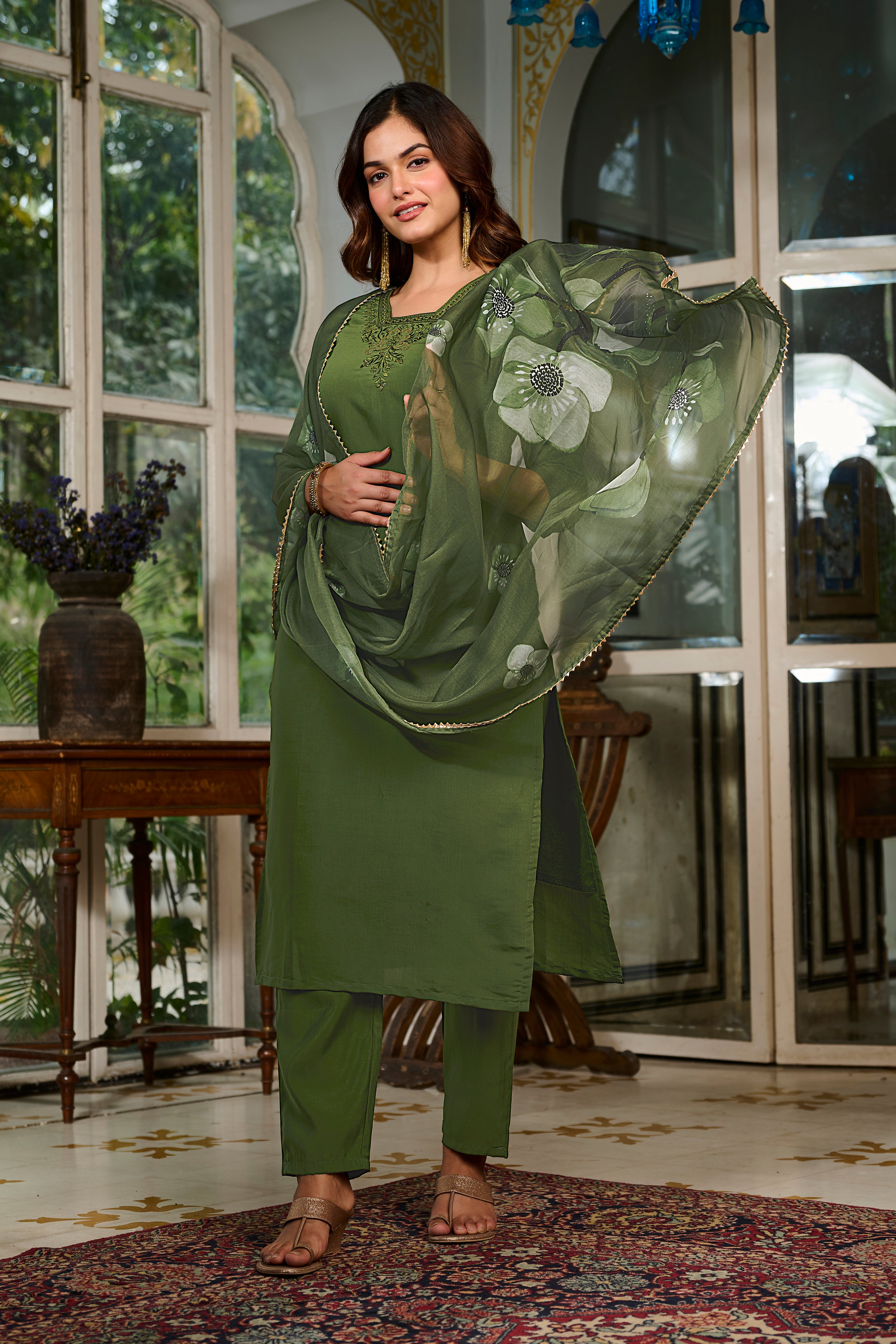 Model in TRENDBUY green kurta set gently holding the floral printed organza dupatta, showcasing its lightweight and flowing fabric