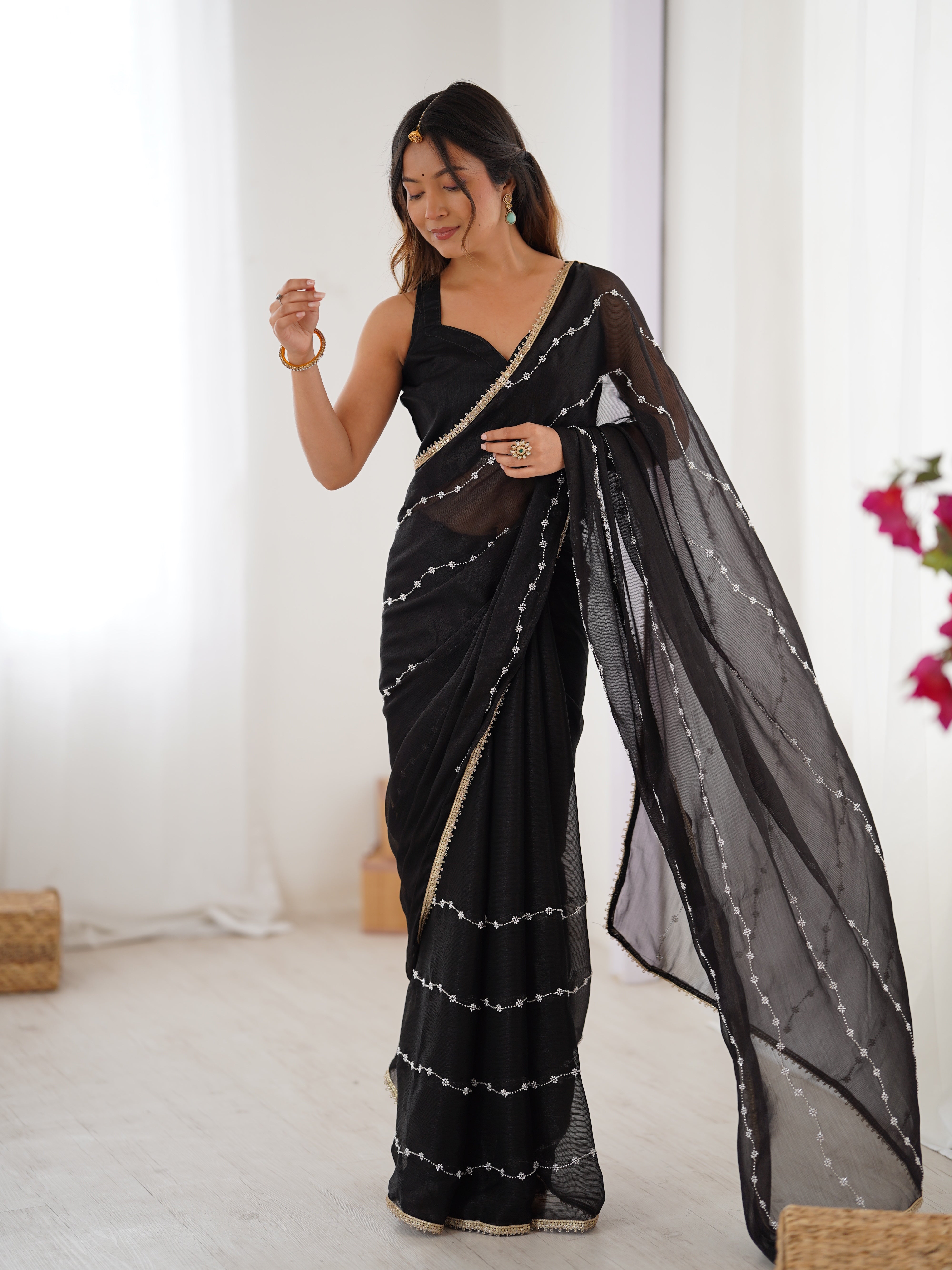 Black Sitara Fabric Saree with sequin embroidery, elegant model full length front view.