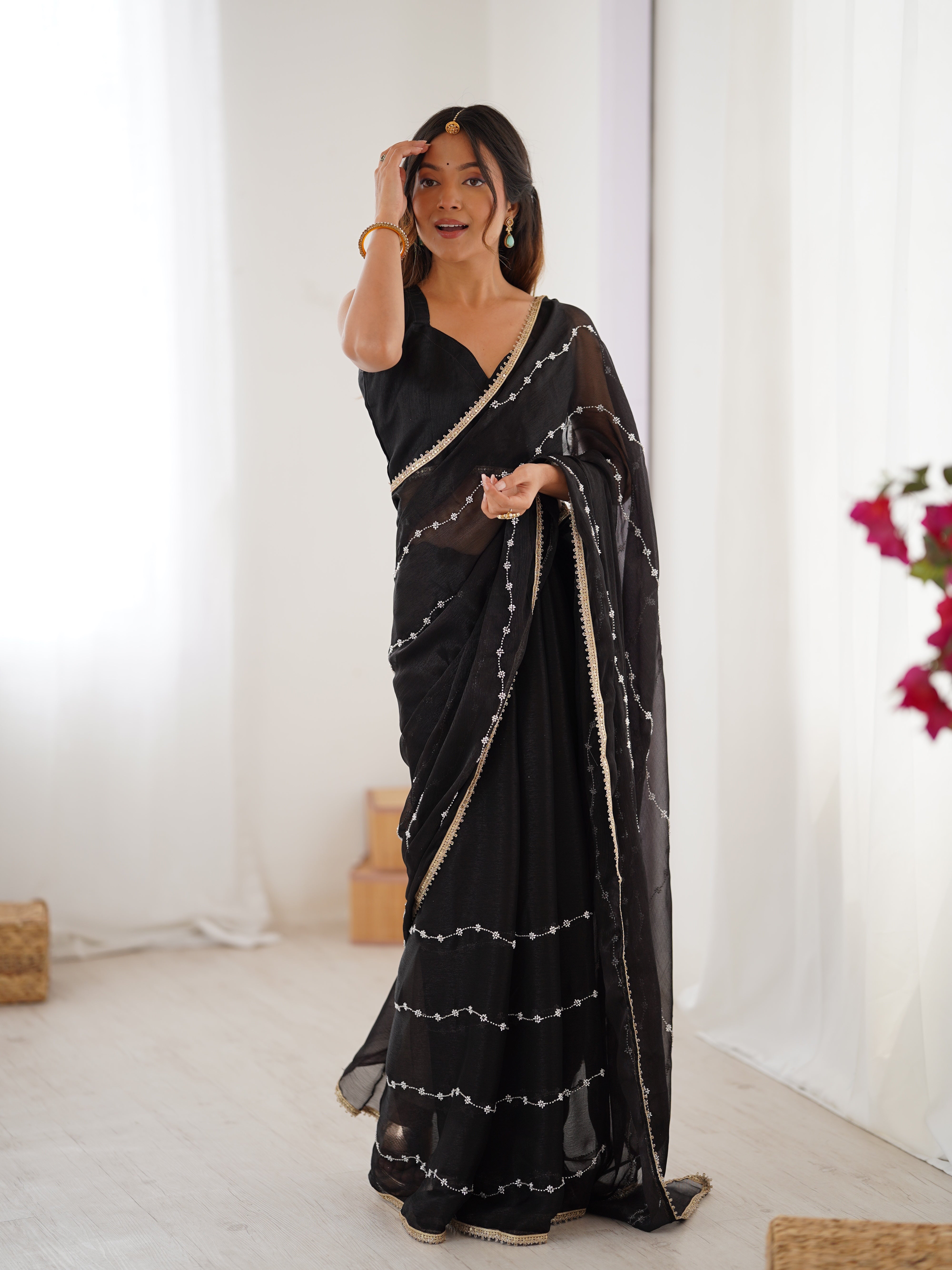 Graceful movement of Black Sitara Saree, with flowing pallu and shimmering sequin design.