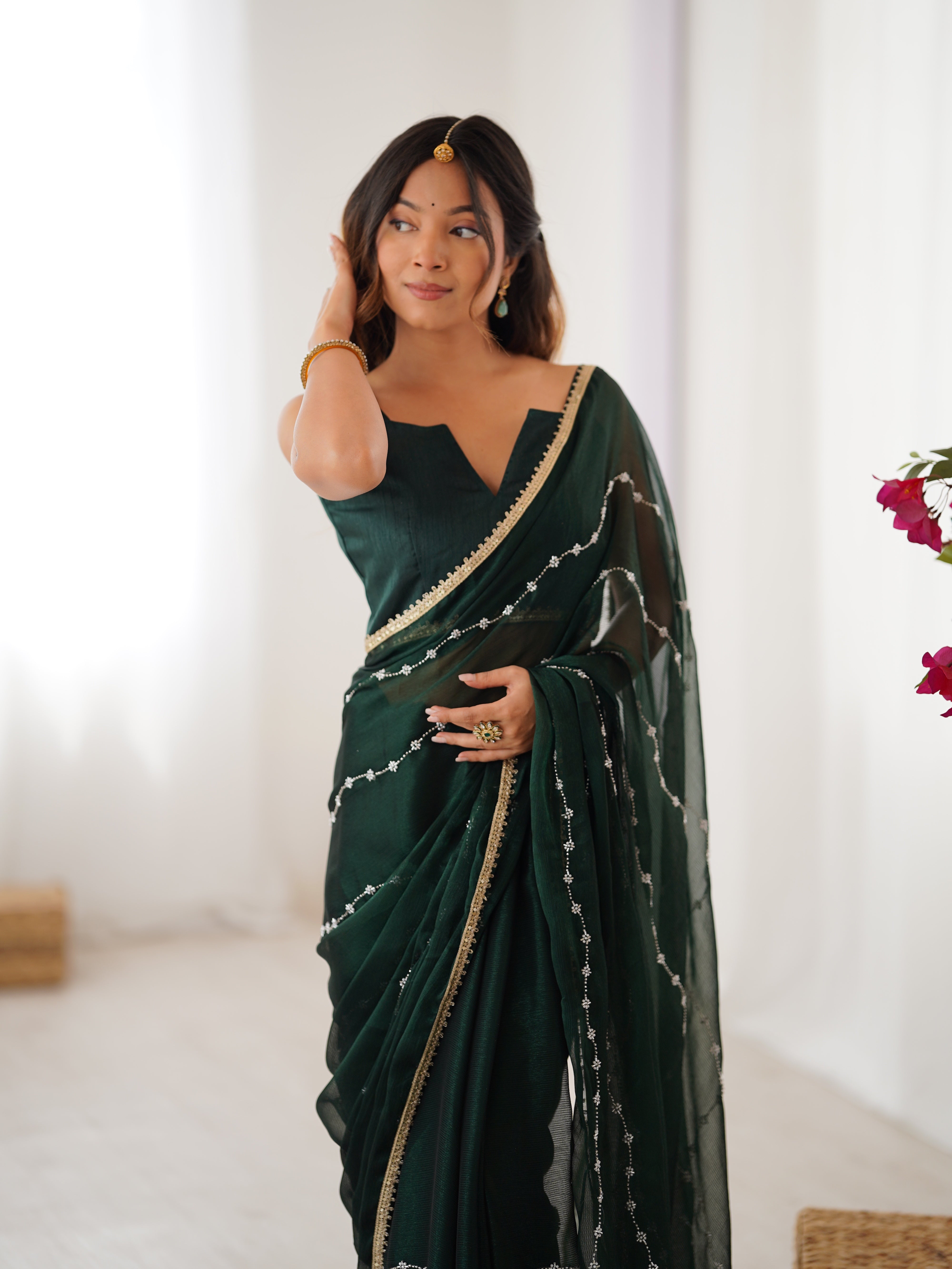Graceful movement of Green Sitara Saree, with flowing pallu and shimmering sequin design.