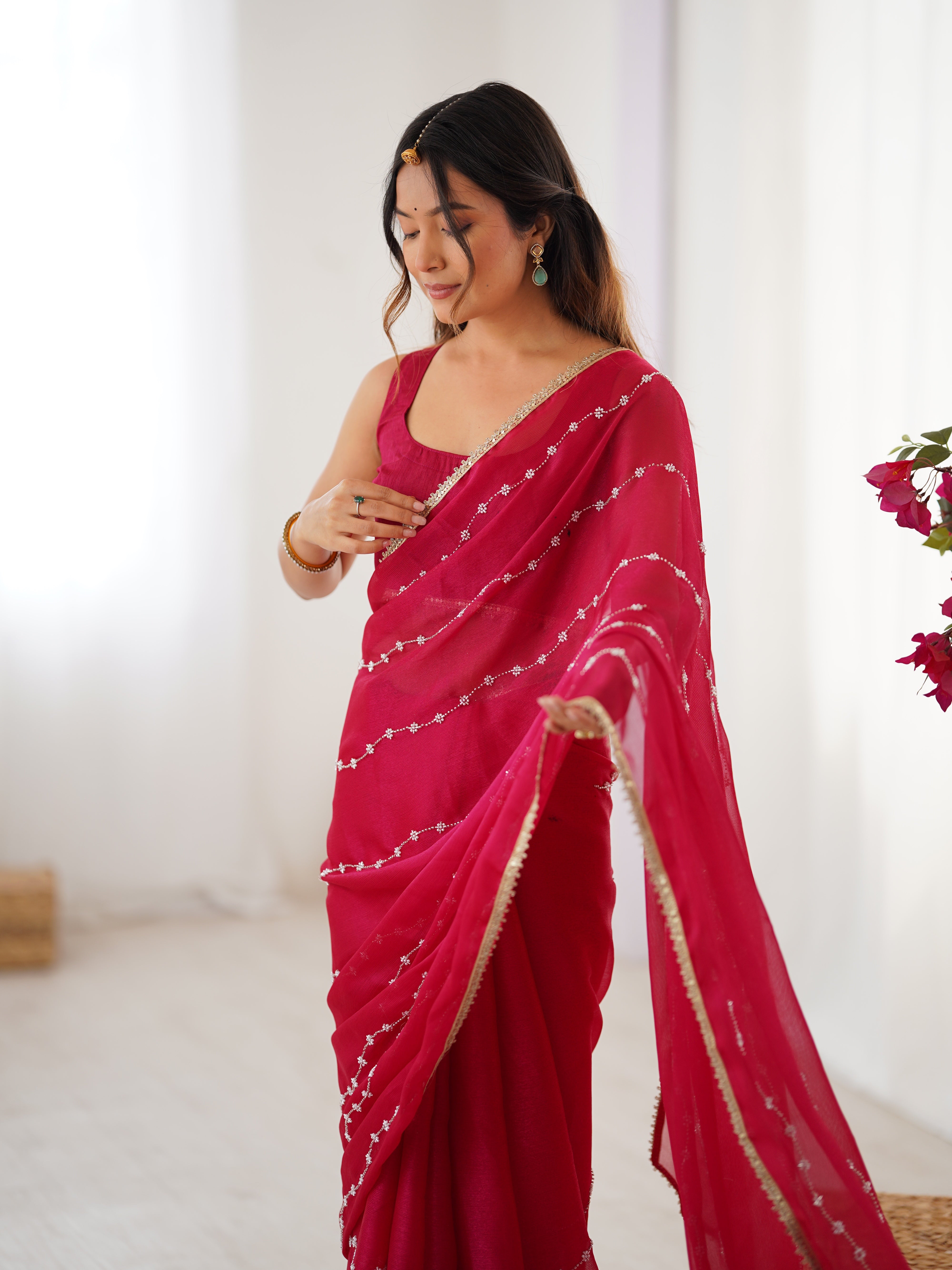 Model in Pink Sitara Saree, side profile showing graceful drape and bead work.