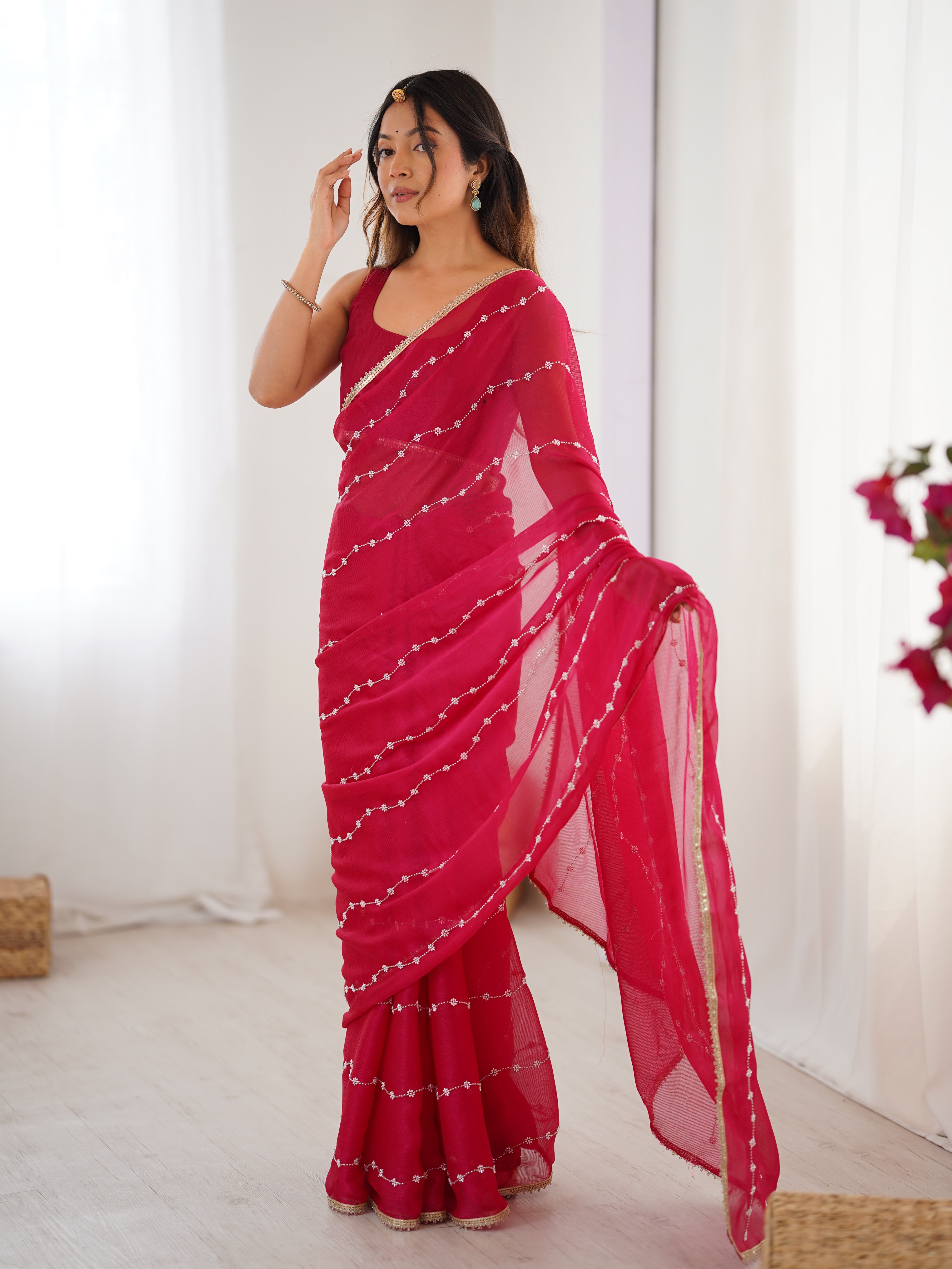 Pink designer saree, close-up of intricate sequin and bead work on Sitara fabric.